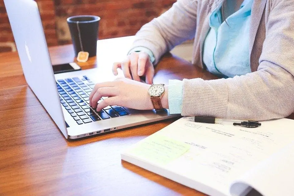 writing content on a laptop